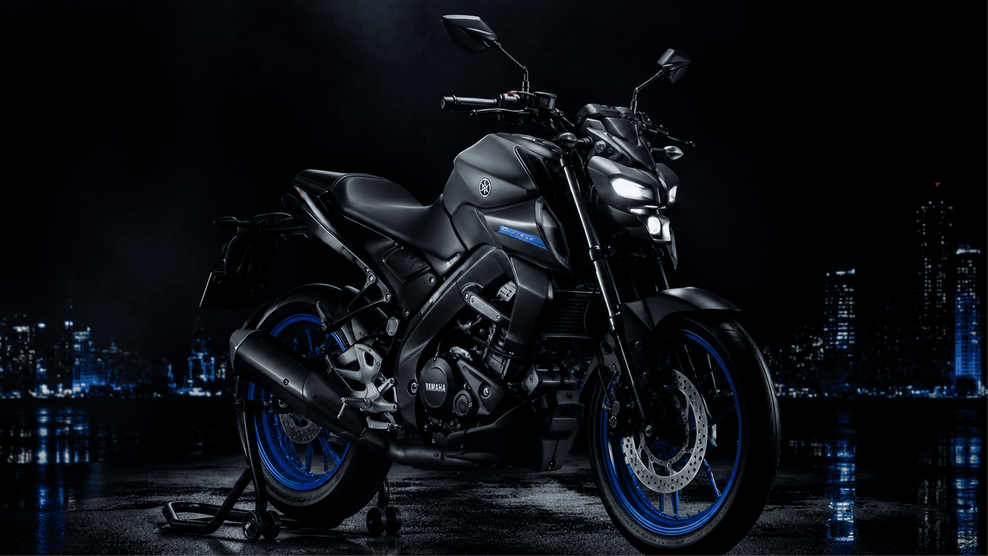 Yamaha YZF-R1 superbike in a dark moody garage with red neon accents
